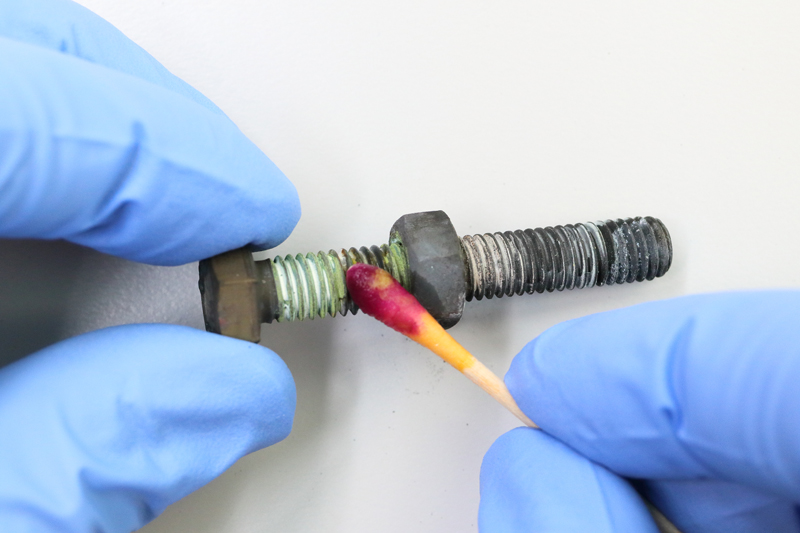 Chromate-test-on-bolt-and-nut Example of a stainless steel 304 (A2) bolt and nut with anti-seize paste after heat treatment. The formed greenish chromate is clearly visible. The TK11™ Chromium-6 Detection Test swab clearly turns red/purple, indicating that chromium-6 is present.